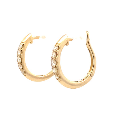 Diamond Huggie Hoops in Yellow Gold by Gabriel & Co.