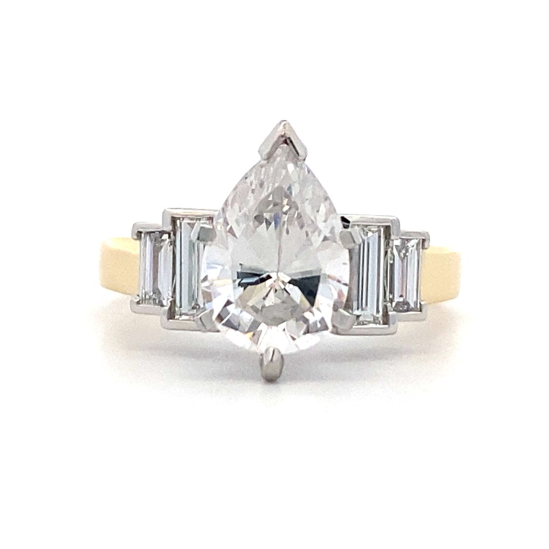 Pear Shape Diamond Side Stone Engagement Ring in Platinum and Yellow Gold