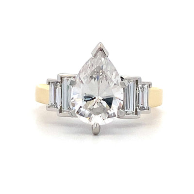 Pear Shape Diamond Side Stone Engagement Ring in Platinum and Yellow Gold