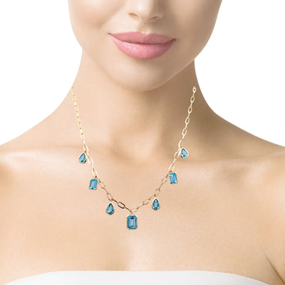 Swiss Blue Topaz Station necklace in Yellow Gold